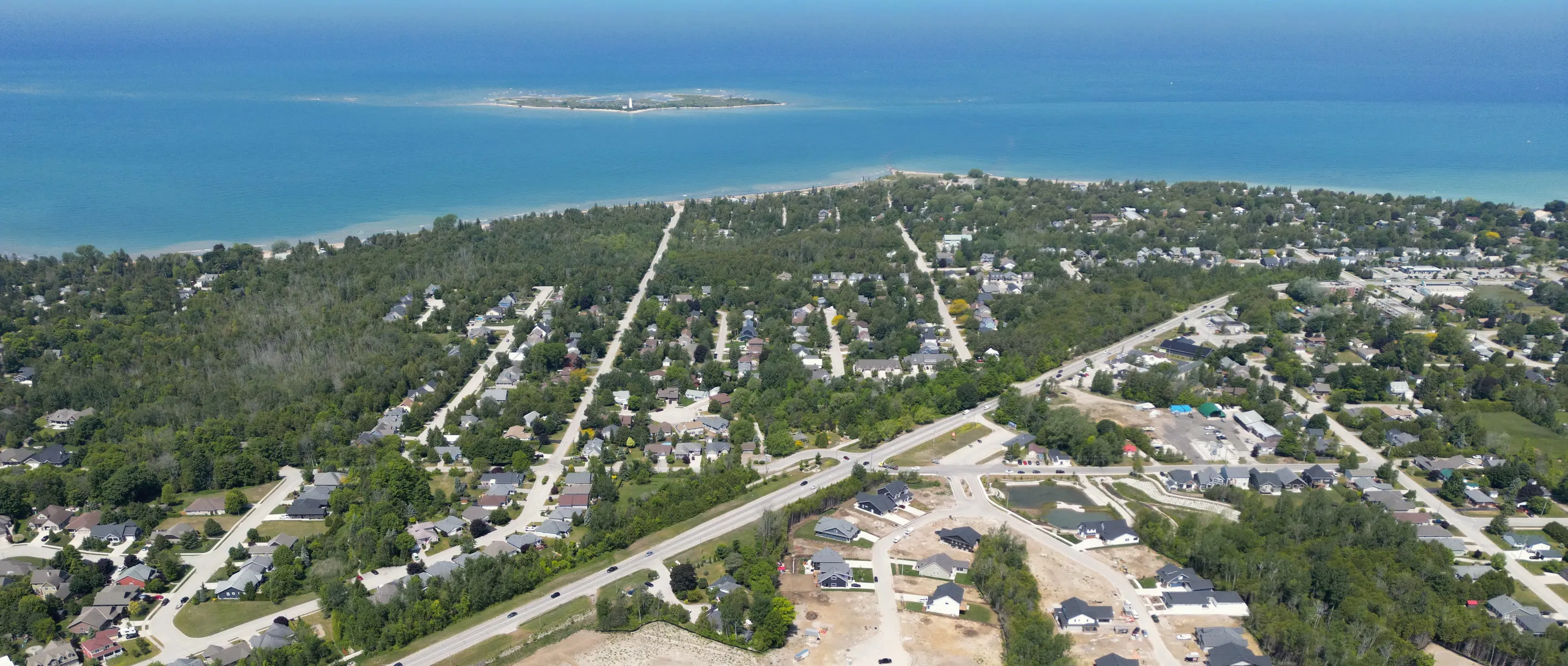 Southampton from above: the town's streets and trees running down to Lake Huron, with Chantry Island offshore
