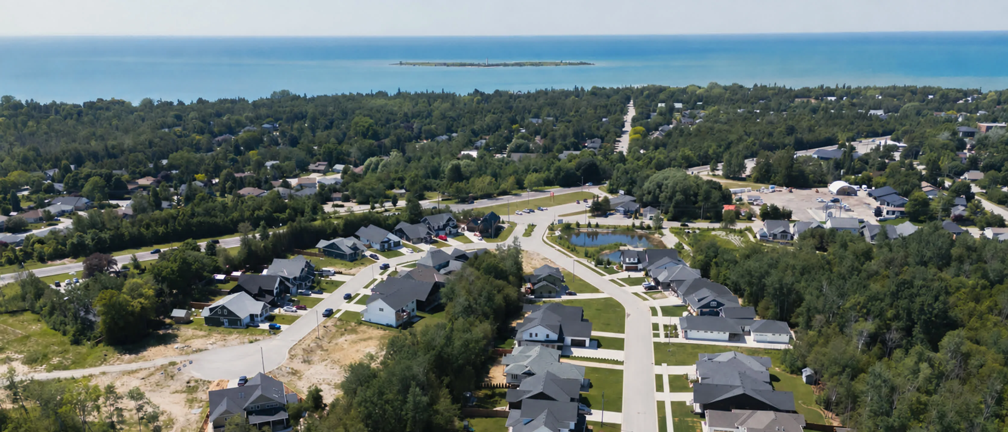 Southampton Landing's finished streets from above, looking west over the town to Lake Huron and Chantry Island